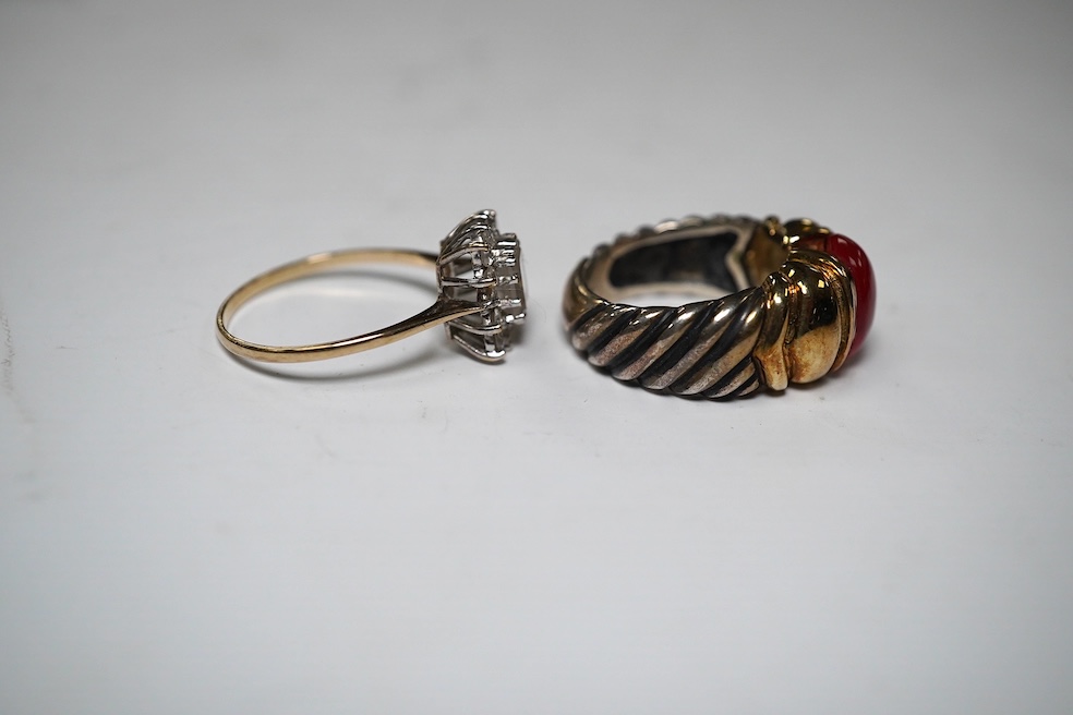 A gold and simulated diamond cluster set ring and a 14k and sterling set ring with cabochon stone. Condition - fair